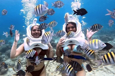 Feel the thrill of helmet diving in curacao—walk the ocean floor, see tropical fish up close, and keep your hair dry. includes water shoes and local guide.