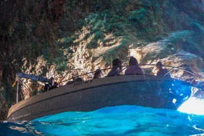 Feel the sea air on a kotor boat tour to blue cave, our lady of the rocks, and mamula island. swim in glowing blue water, hear wwii stories, includes guide & equipment.