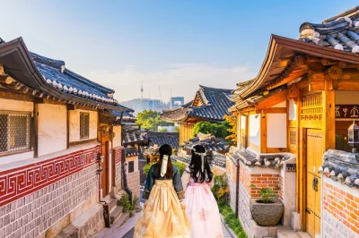 Start your seoul day trip with hanbok photos at gyeongbokgung, wander bukchon hanok village, taste gwangjang market food, and relax with hotel pickup.