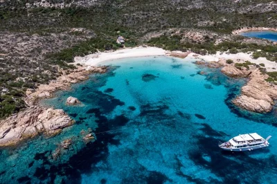 Hear gulls overhead, swim at santa maria & spargi, and stroll la maddalena’s old town on this boat trip from palau. includes guide & onboard amenities.