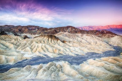 Watch the sun dip behind death valley’s wild colors, walk salt flats at badwater basin, and stargaze under dark desert skies. includes hotel pickup and guide.