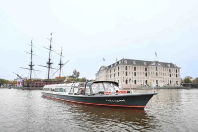 Step onto a warm, covered boat for a 1-hour amsterdam canal cruise with bar, live english guide, and local stories. includes weather guarantee and city highlights.