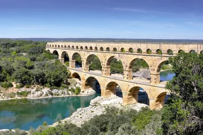 Step into roman history with a small group day trip from avignon to nimes, uzes, and pont du gard. includes entry tickets, bottled water, and local guide pickup.
