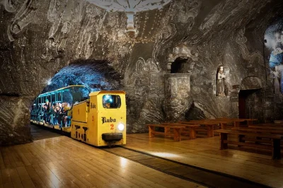 Feel the cool air of bochnia salt mine near krakow, ride a mining train, float underground by boat, and hear stories from locals. includes hotel pickup & audioguide.