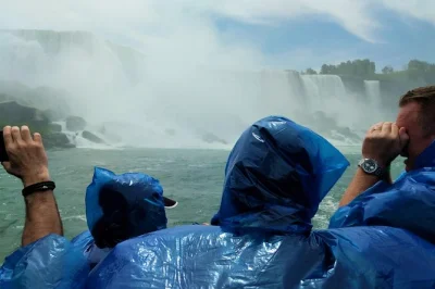 Feel the spray on maid of the mist, stand above niagara falls from skylon tower, and cross borders with a local guide. includes hotel pickup and all attraction fees.