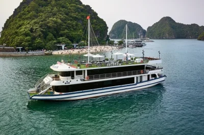 Feel the rhythm of halong bay on a 5-star day cruise with buffet lunch, wine, kayaking, and a sunset jacuzzi. includes hotel pickup and local guide.
