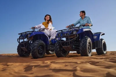 Feel the thrill of dubai’s red dunes with quad biking, dune bashing, and a bbq dinner show. includes hotel pickup, expert guide, and live cultural performances.