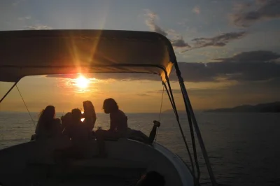 Feel the sea breeze on a cinque terre sunset boat tour, enjoy a swim, local aperitif, and village stroll. includes drinks, snacks, and pickup options.