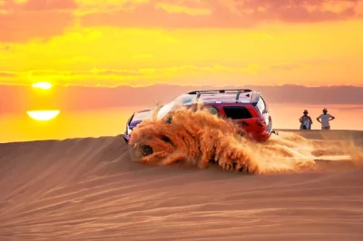 Feel the rush of dune bashing at al madam’s red sands near dubai, enjoy a bbq dinner under the stars, and watch live fire and dance shows. includes pickup.