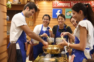 Start your bangkok morning with a lively market walk, hands-on thai cooking class, and homemade curry paste. includes lunch, recipes, and local instructor.