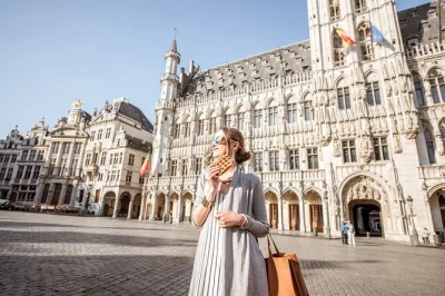 Get lost in brussels’ grand place, taste belgian chocolate, wander bruges’ canals. includes round-trip transport from amsterdam & a local guide for real stories.