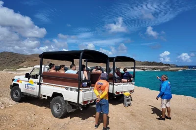 Feel aruba’s wild north coast on a guided arikok jeep tour, swim in the natural pool, explore ancient caves, and snack on pastechi. includes entry and gear.