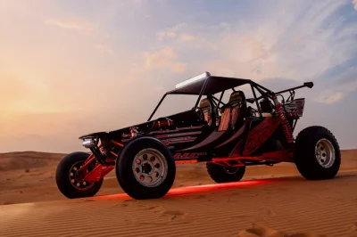 Feel the rush of a dubai dune buggy safari on the red sands near fossil rock, with sandboarding and pickup included. small group, local guides, bottled water.