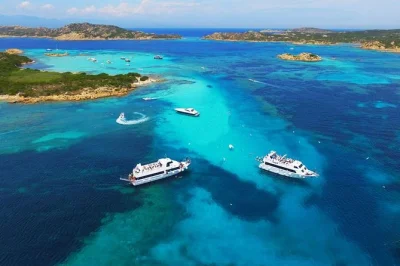 Feel the salt air on a sardinian boat tour to la maddalena, with swim stops at spargi and budelli, chef’s pasta lunch, and local crew. includes insurance.