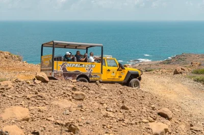 Feel aruba’s wild side on an off-road safari to the natural pool and natural bridge, with hotel pickup, snorkeling gear, and a local guide included.
