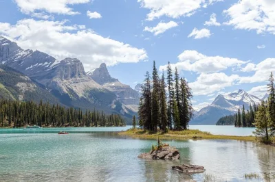 Breathe in the wild air of jasper as you cruise maligne lake to spirit island, spot wildlife with a local guide, and wander the shores—includes hotel pickup.
