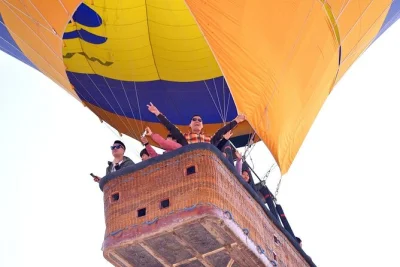 Float over luxor at sunrise in a hot air balloon, cross the nile by boat with breakfast, and enjoy a folkloric show after landing. includes hotel pickup and drop-off.