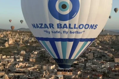 Float above cappadocia’s fairy chimneys at sunrise, watch balloon inflation up close, and toast with champagne after landing. includes hotel pickup and flight certificate.