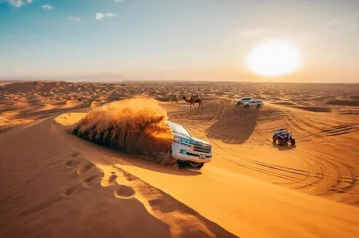 Feel the rush of dubai’s red dunes with quad biking, sandboarding, and a premium bbq dinner in a luxury desert camp. includes hotel pickup and live shows.