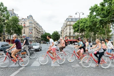 Feel the rhythm of paris on a city bike tour with a local guide, rolling past the eiffel tower, louvre, and river bridges. includes helmet, child seat, and bike.