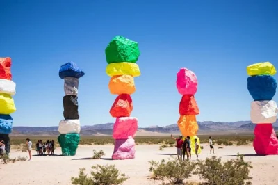 Feel the desert air at grand canyon west, walk hoover dam, and snap photos at 7 magic mountains on a small-group las vegas day trip with hotel pickup and lunch.