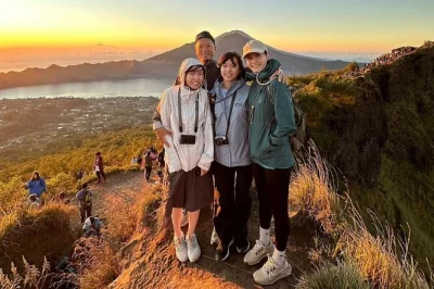 Wake up early for a mount batur sunrise trek from bali, hiking with a local guide and sharing breakfast at the summit. includes hotel pickup and all equipment.