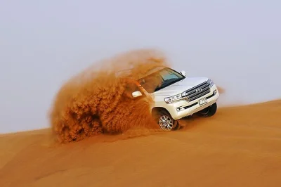 Feel the rush of dubai’s red dunes with 4x4 dune bashing, a camel ride, sunset photos, and a bbq dinner at a desert camp. includes hotel pickup & local guide.