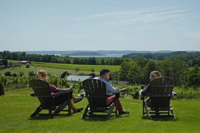 Feel the breeze on a traverse city wine tour, tasting local varietals at four old mission peninsula wineries. includes shuttle pickup, guide & air-conditioned bus.