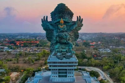 Feel the spray at nusa dua’s water blow, walk beneath garuda wisnu kencana, relax on pandawa beach, and watch sunset kecak dance—private car & lunch included.