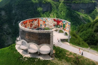 Feel the wild air of kazbegi, taste mountain honey in gudauri, and explore ananuri fortress on a small-group day trip from tbilisi with pickup and local guide.