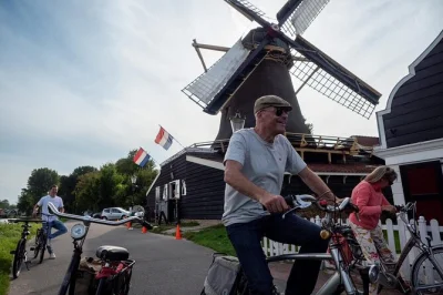 Pedal from amsterdam into quiet villages, taste gouda at a family farm, see a working windmill and ride e-bikes with a local guide. includes cheese tasting & demo.