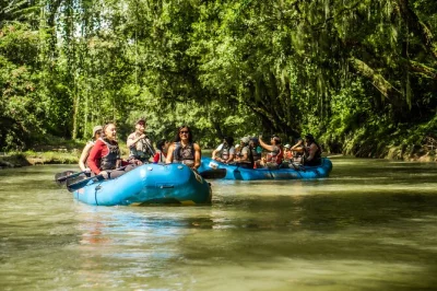 Float quietly down costa rica’s peñas blancas river, spot wildlife, and share homemade snacks at a local farm—includes hotel pickup and local guide.