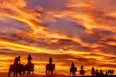 Breathe in the desert air on a sunset horseback ride near las vegas, following old outlaw trails with a local wrangler. includes hotel pickup & cowboy bbq dinner.
