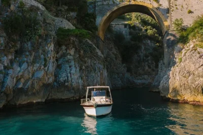 Glide along the amalfi coast by private boat, swim in hidden caves, visit positano & praiano, and relax with drinks. includes snorkeling gear & local captain.