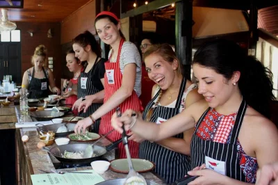 Feel the pulse of hua hin’s 100-year-old market, cook classic thai dishes in a teak house, and share laughs with local chefs. includes pickup, lunch, and recipes.