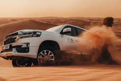 Feel the dubai desert with dune bashing, sandboarding, camel rides, and a live bbq dinner at sunset. includes hotel pickup, shows, and local guide.