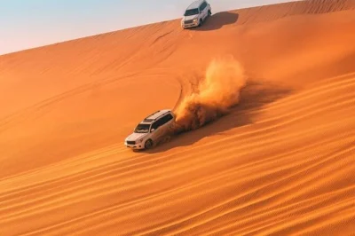 Feel the desert’s contrasts near doha with dune bashing, a camel ride, sand boarding, and sunrise by the inland sea. includes pickup and local guide.