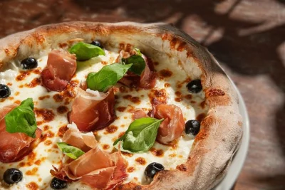 Feel the buzz of rome as you make your own pizza near piazza navona, sip prosecco, and share laughs with locals. includes drinks, appetizers, and a cozy setting.