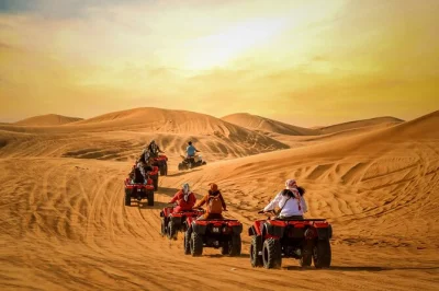 Feel the thrill of dune bashing near dubai, ride camels at sunset, try quad biking, and enjoy a bbq dinner with live shows at a bedouin camp. includes pickup.