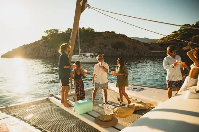 Step onto a private catamaran from ibiza to formentera, swim in turquoise coves, snorkel with included gear, and relax with flexible lunch options—captained by locals.