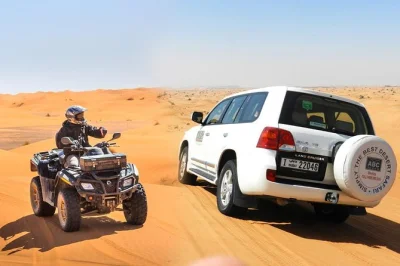 Feel the rush of dubai’s red dunes with a real open desert quad ride, 4x4 dune bashing, camel rides, and a majlis camp bbq. includes hotel pickup.