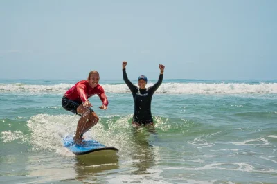 Feel the gold coast vibe with a beginner surf lesson at surfers paradise. learn in warm, waist-deep water, all gear included, guided by local surf lifesavers.