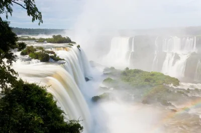 Feel the spray at iguaçu falls on a guided day trip from foz do iguaçu, with entry tickets, hotel pickup, and a stop for homemade chocolate. easy booking.