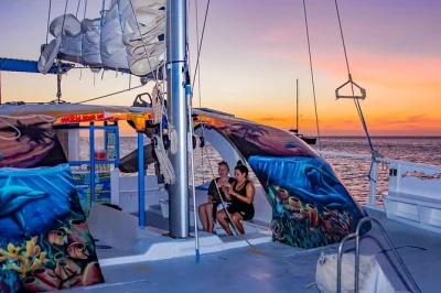 Feel the breeze on an aruba sunset sail cruise, enjoy an open bar, snacks, and a swim stop. includes music, rope swing, and easy beach check-in.