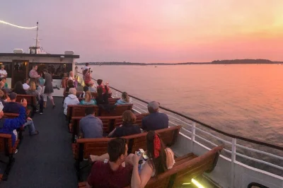 Feel the sea breeze on a casco bay sunset cruise from portland, with lighthouse views, city lights, and stories from a local guide. includes restroom onboard.