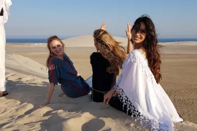 Feel the rush of qatar’s desert with dune bashing, a camel ride, and tea by the inland sea. includes pickup, sand boarding, and time to relax at a local camp.