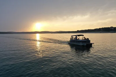 Watch the sun dip over lake travis on a 90-minute byob boat tour with a local captain, stories, and city views. includes marina departure and group seating.