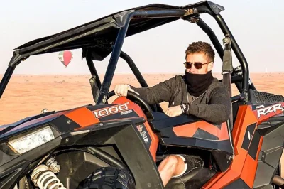 Feel the dubai desert wake up on a morning buggy safari, try sandboarding on red dunes, and ride a camel with local guides. includes water and pickup.