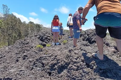 Feel the mist at rainbow falls, walk lava fields in volcano park, taste macadamia nuts and kona coffee. includes pickup from hilo port and local guide insights.