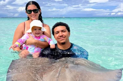 Swim with stingrays at stingray city, snorkel vibrant coral garden reefs, and wade among starfish at starfish point—includes pickup, gear, and local crew.